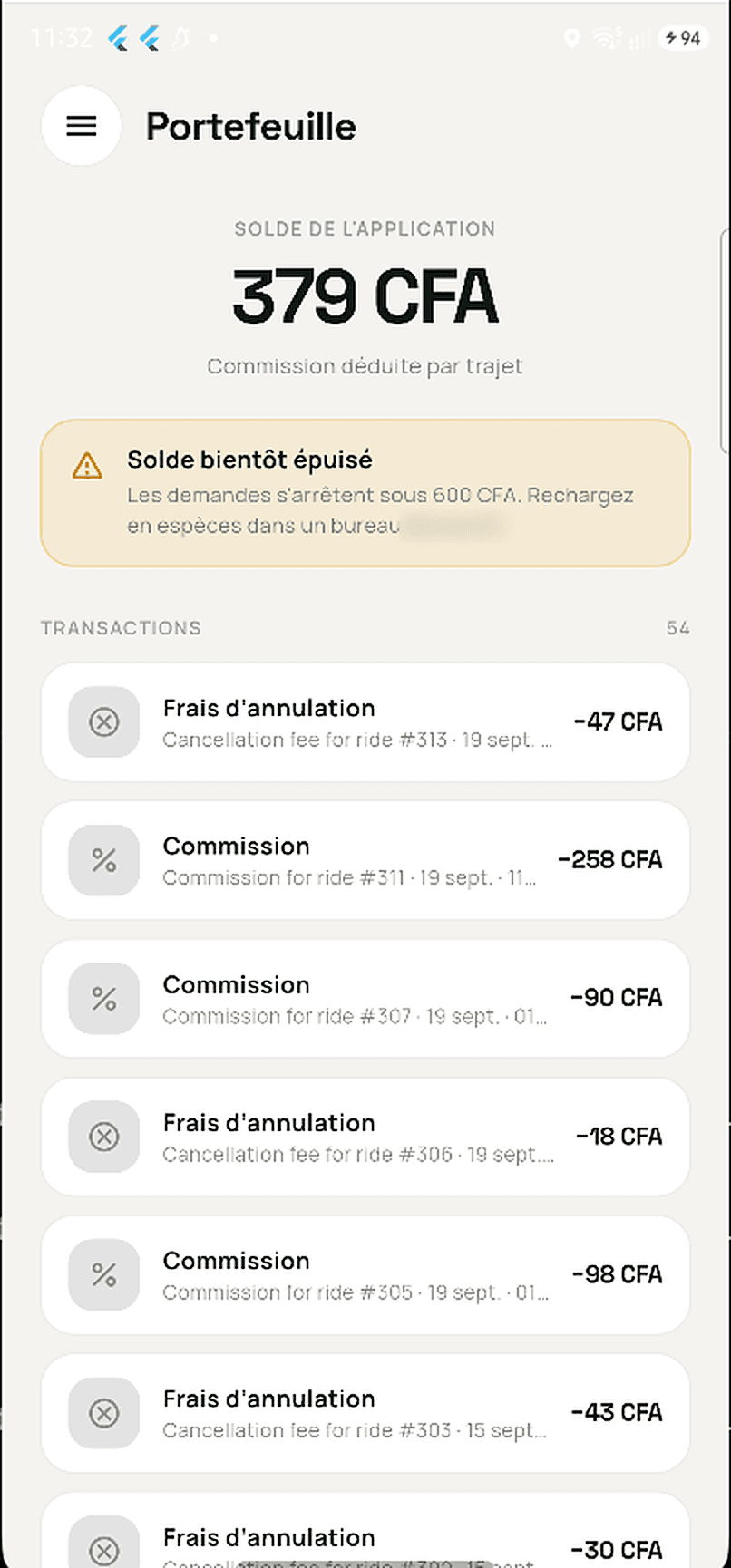 Portefeuille chauffeur avec le solde, une alerte de solde bas et la liste des commissions et frais
